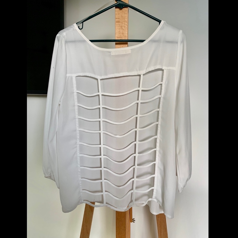 Super cute flowy blouse with caged back